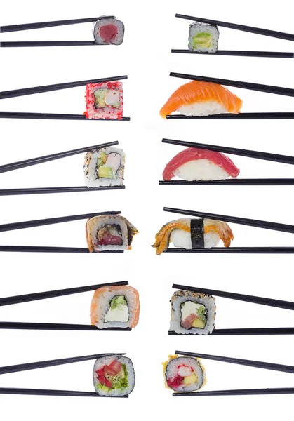 Sushi in chopsticks isolated on white background — Stock Photo, Image