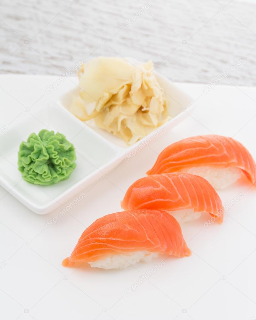 Salmon sushi nigiri on a white plate