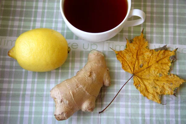 Black hot tea with fresh and natural lemon and ginger root is good for treating colds and viral diseases.