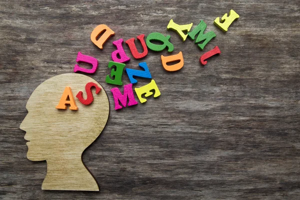 Letters coming out of head — Stock Photo, Image