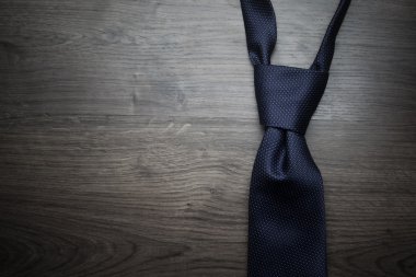 Male necktie on dark textured background clipart