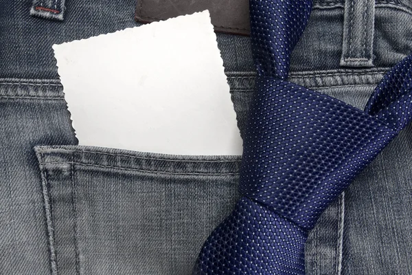 Closeup view of a necktie on jeans trousers. — Stock Photo, Image