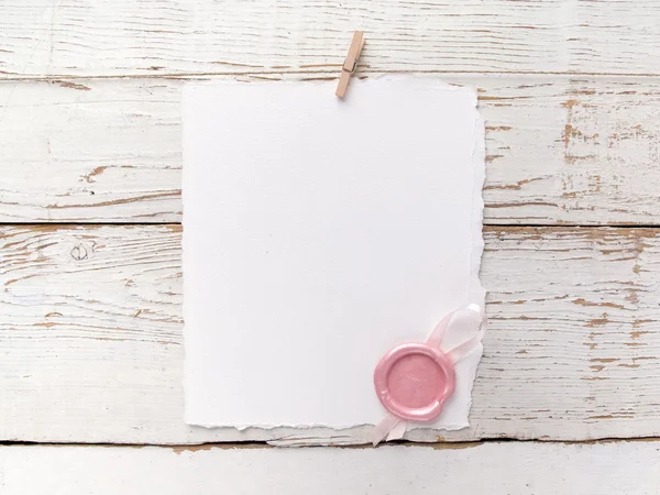 Wax seal and white paper on wooden background — Stock Photo, Image