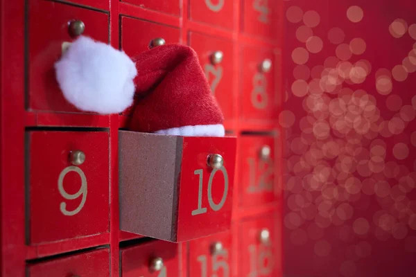 Red wooden Advent calendar with surprise for Christmas — Stock Photo, Image