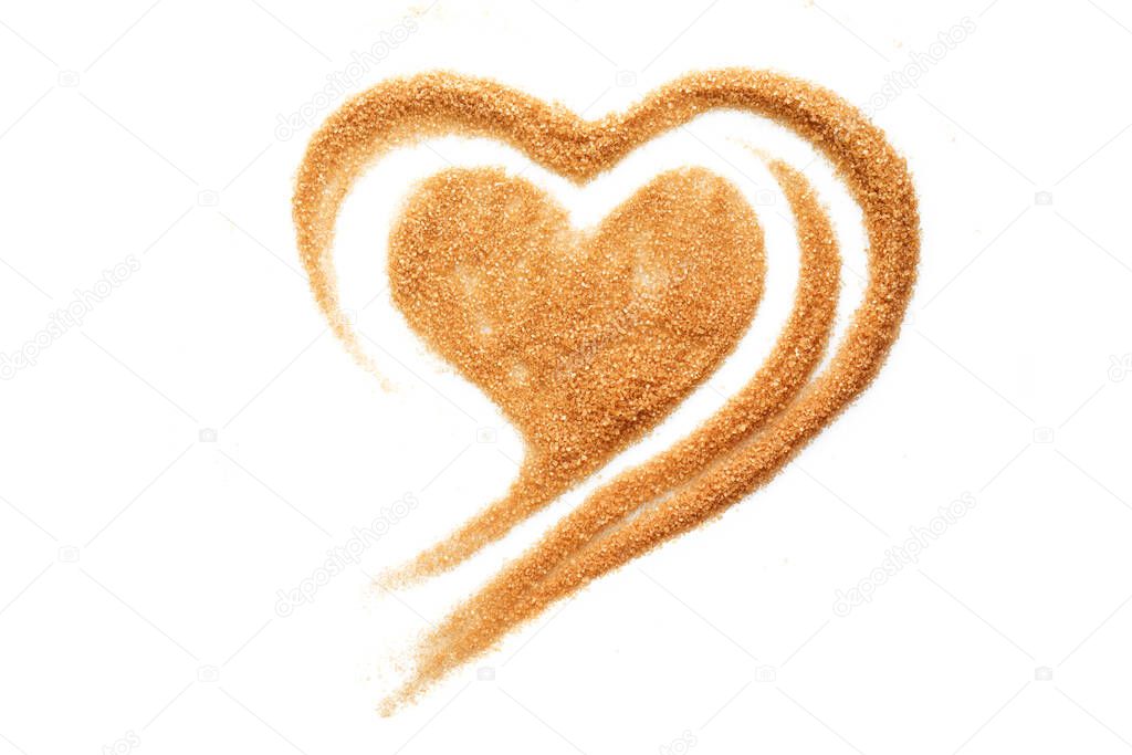 Broun sugar heart shaped scrub isolated on white background.