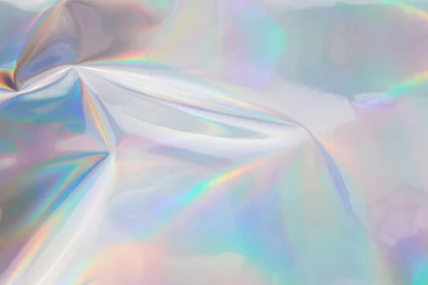 Fondo de lámina arrugada halográfica arco iris. Fondo de color pastel abstracto. — Foto de Stock