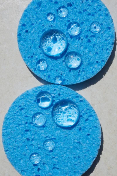 Blue sponge close up with water drops. Face Cleansing and Make Up Removing Beauty Routine — Stockfoto