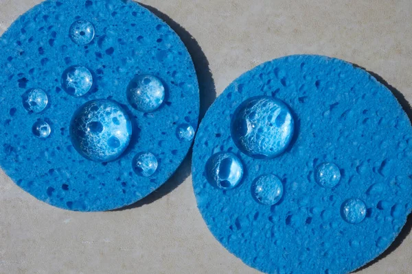 Blue sponge close up with water drops. Face Cleansing and Make Up Removing Beauty Routine — Stockfoto