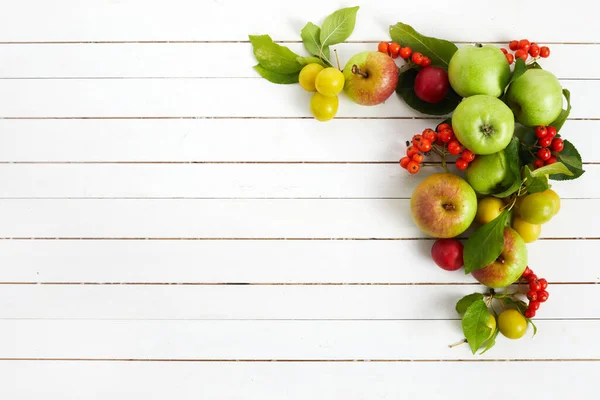 Framework with Autumn yellow, orange and red vegetables and fruits on white wooden background, top view, flat lay. Autumn background. — Stock Photo, Image