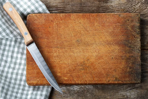 Cutting board with a knife — Stock Photo, Image