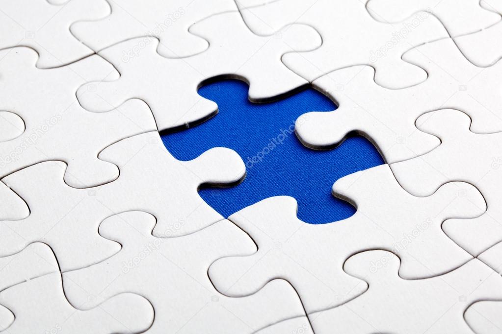 Plain white jigsaw puzzle, on Blue background