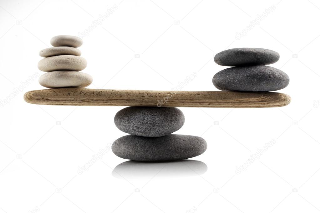 balancing stones on white 