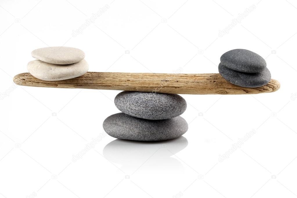 balancing stones on white 