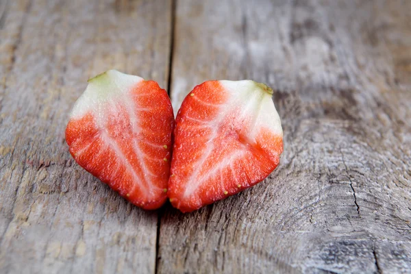 Strawberry heart-shaped on wood — Stock Photo, Image