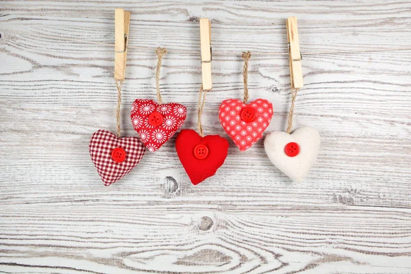 Heart-shaped decoration on wooden background — Stock Photo, Image