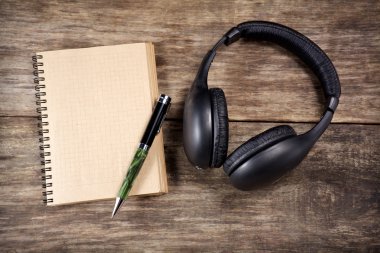 Vintage Headphones and paper note on wood clipart