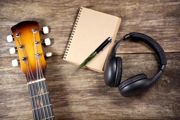 Headphone guitar notebook pencil — Stock Photo, Image
