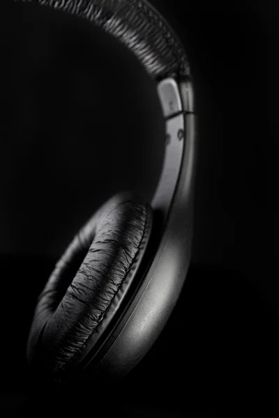 Headphones on a black — Stock Photo, Image