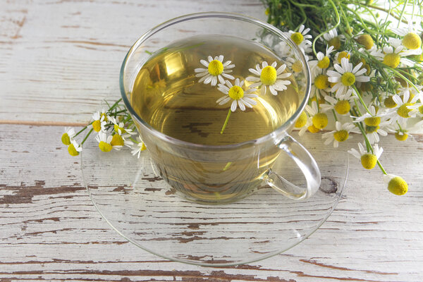 cup of chamomile tea with flowers