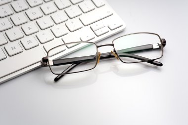 glasses on the computer keyboard 