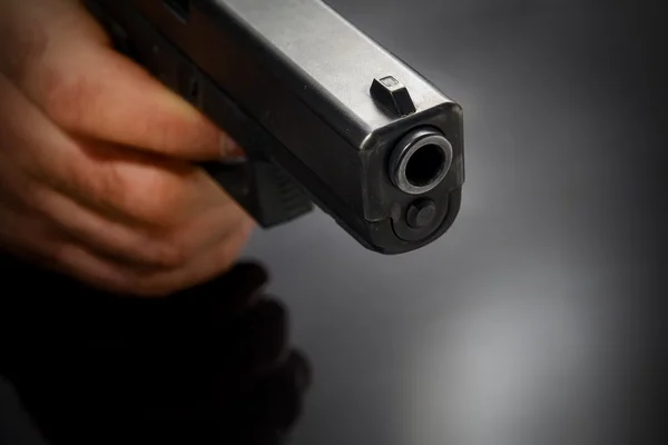 Male hand with a gun — Stock Photo, Image