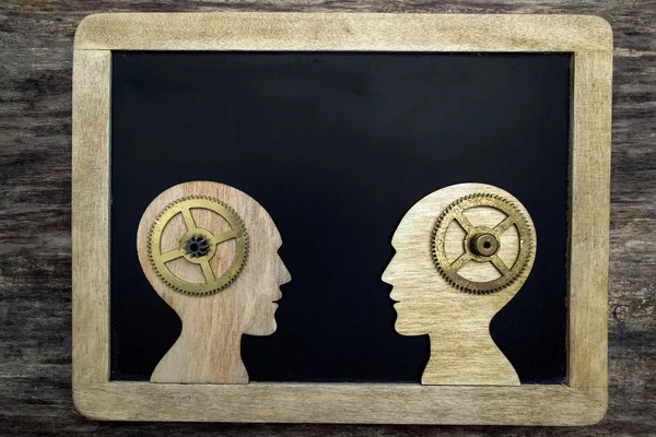 Two human head silhouettes with gears — Stock Photo, Image