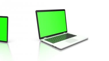 Modern dizüstü ve tablet yeşil bir ekran ile. Beyaz arka plan üzerinde animasyon. 