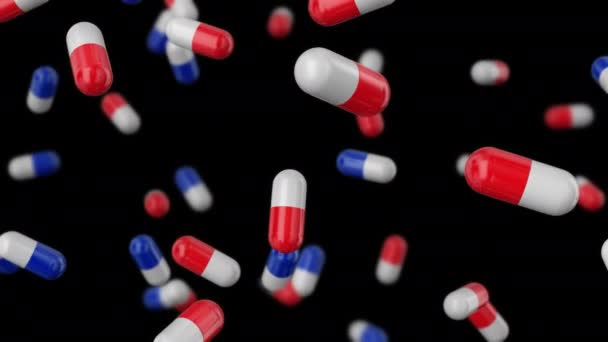Medische capsules rood-wit en wit-blauw vallen naar de bodem op een transparante achtergrond. — Stockvideo