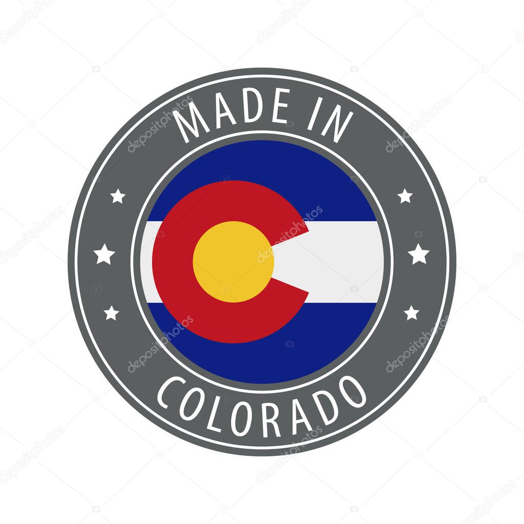 Made in Colorado icon. Gray stamp with a round state flag.