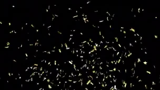 Goldenes Konfetti Verschiedenen Formen Explodiert Und Fällt Auf Einen Schwarzen — Stockvideo