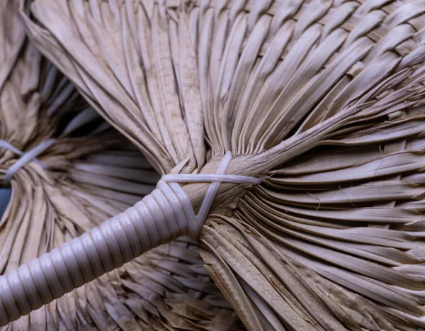 Round chinese straw decorative hand fan closeup