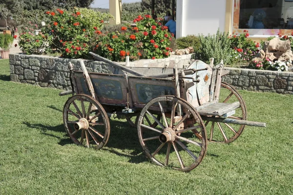 An old cart in the interior of the site near the house Stock Photo