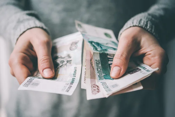 Hands holding currency — Stock Photo, Image