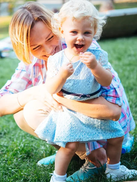 Mother and daughter during a walk outdoors — Stock Photo, Image