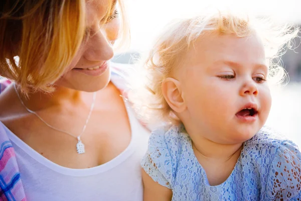 Mother and daughter during a walk outdoors — Stock Photo, Image