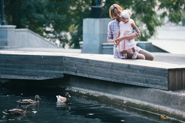 Mother and daughter during a walk outdoors — Stock Photo, Image