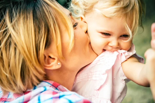 Mother and daughter during a walk outdoors — Stock Photo, Image