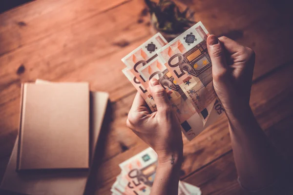 Hands holding euro money — Stock Photo, Image