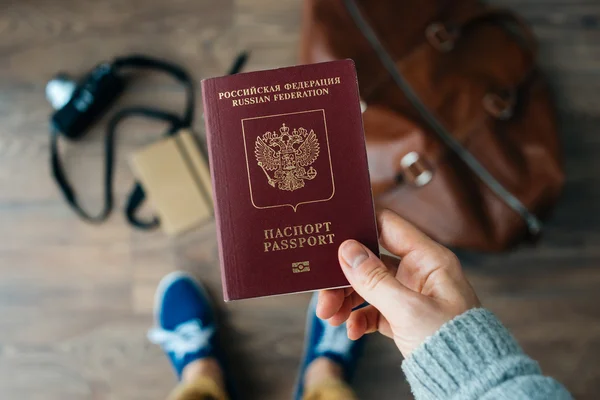 Person holds Russian travel passport