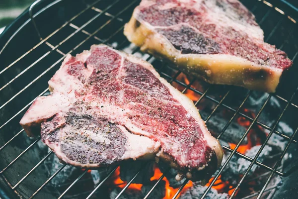 Beef steaks on the grill — Stock Photo, Image