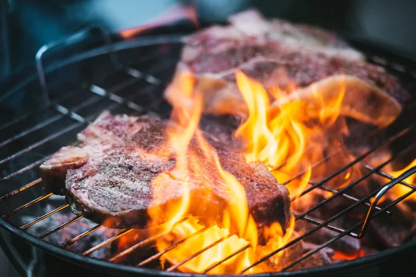 Beef steaks on the grill — Stock Photo, Image