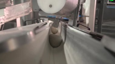 Bread dough on the production line in the baking industry. Production of bakery products.