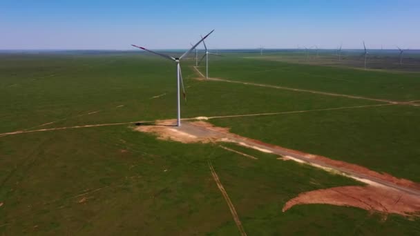 Birds-eye view of the farm landscape and wind turbines — Wideo stockowe