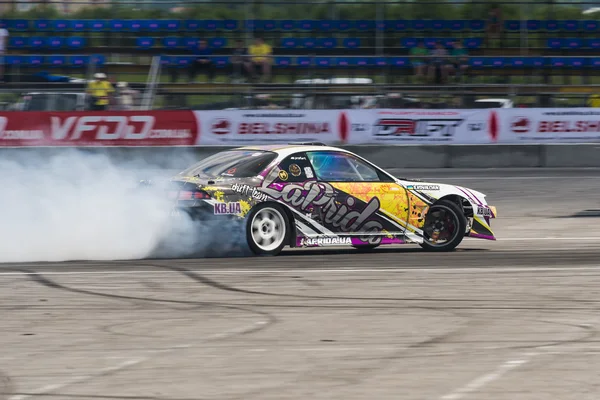 Unknown rider on the car brand Honda overcomes the track — Stock Photo, Image