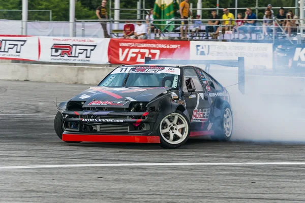 Neznámý jezdec na auto značky Honda překonává trať — Stock fotografie