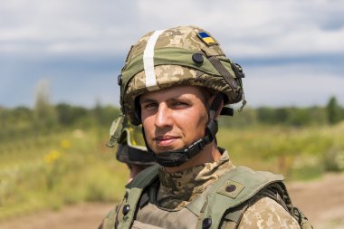 Ukrainian commando   rests  after training fight clipart