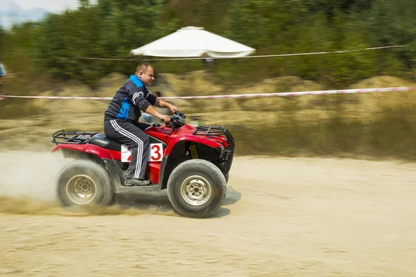 ATV overcomes the track — Stockfoto