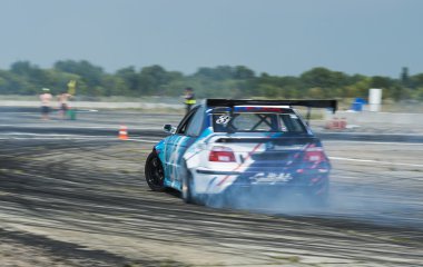 Rider Igor Zapisniy  on the car brand BMW overcomes the track