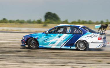 Rider Igor Zapisniy  on the car brand BMW overcomes the track