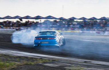 Unknown riders on the cars brand Honda   overcomes the track